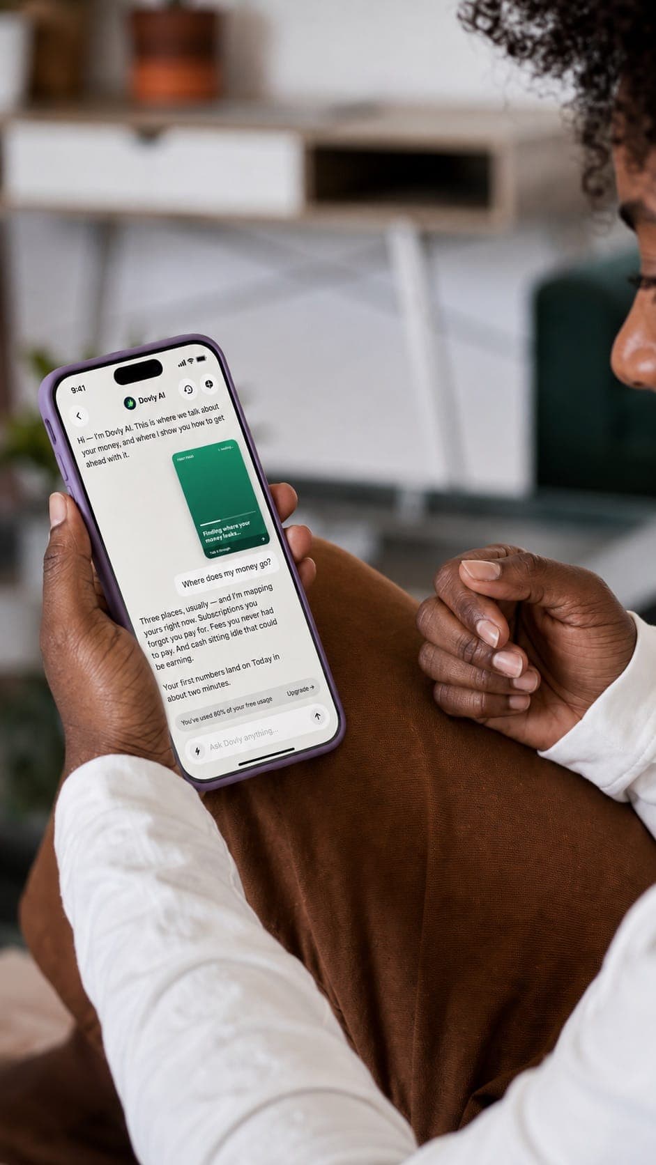 The Dovly AI chat answering "Where does my money go?" with subscriptions, fees and idle cash.