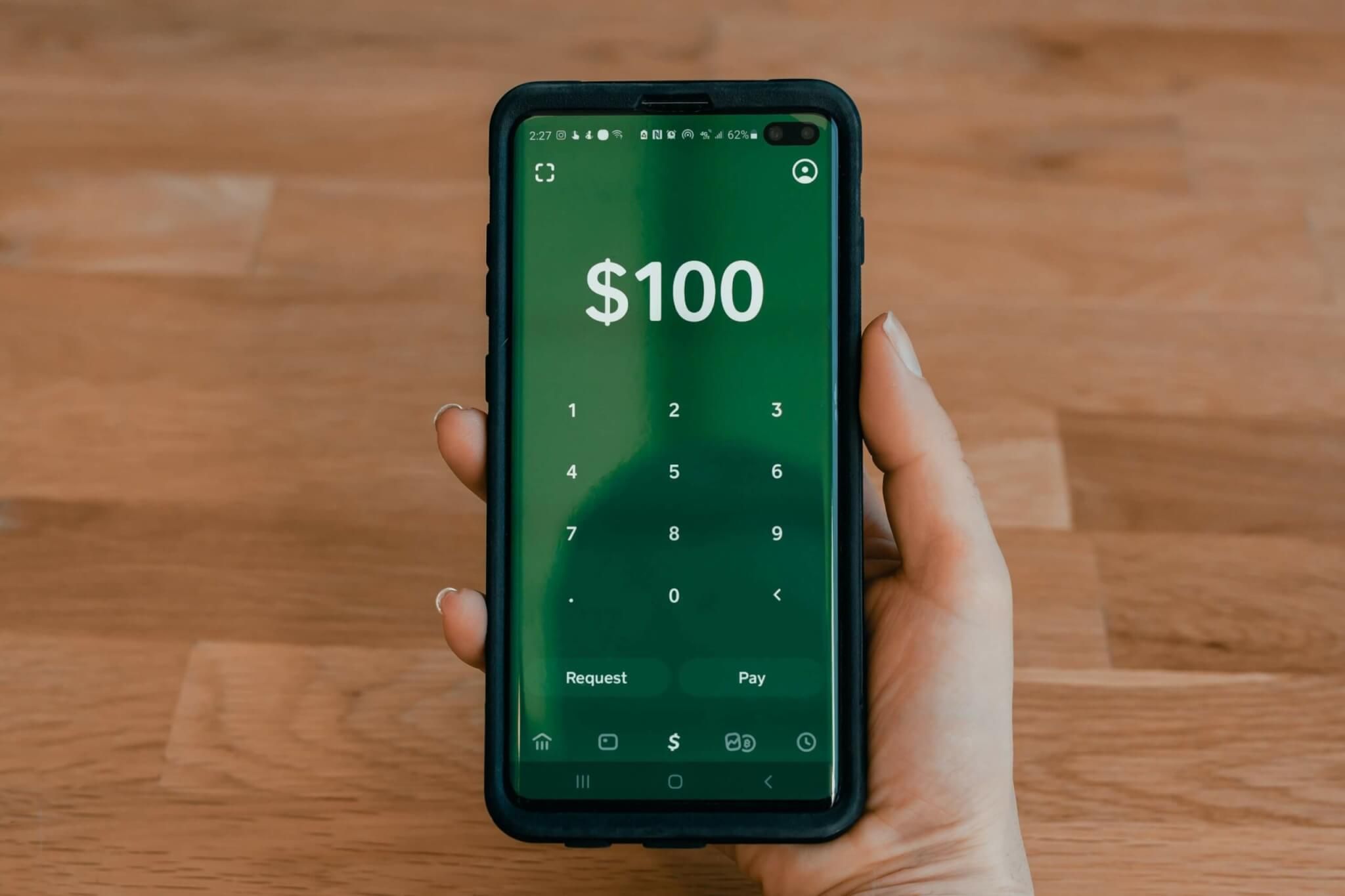 phone screen displaying a mobile banking page that has $100