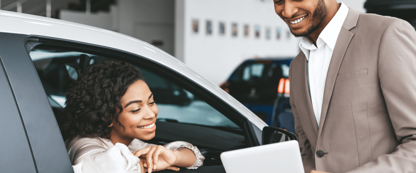 A woman looking to rent a car, and checking if her credit score can get her approved.