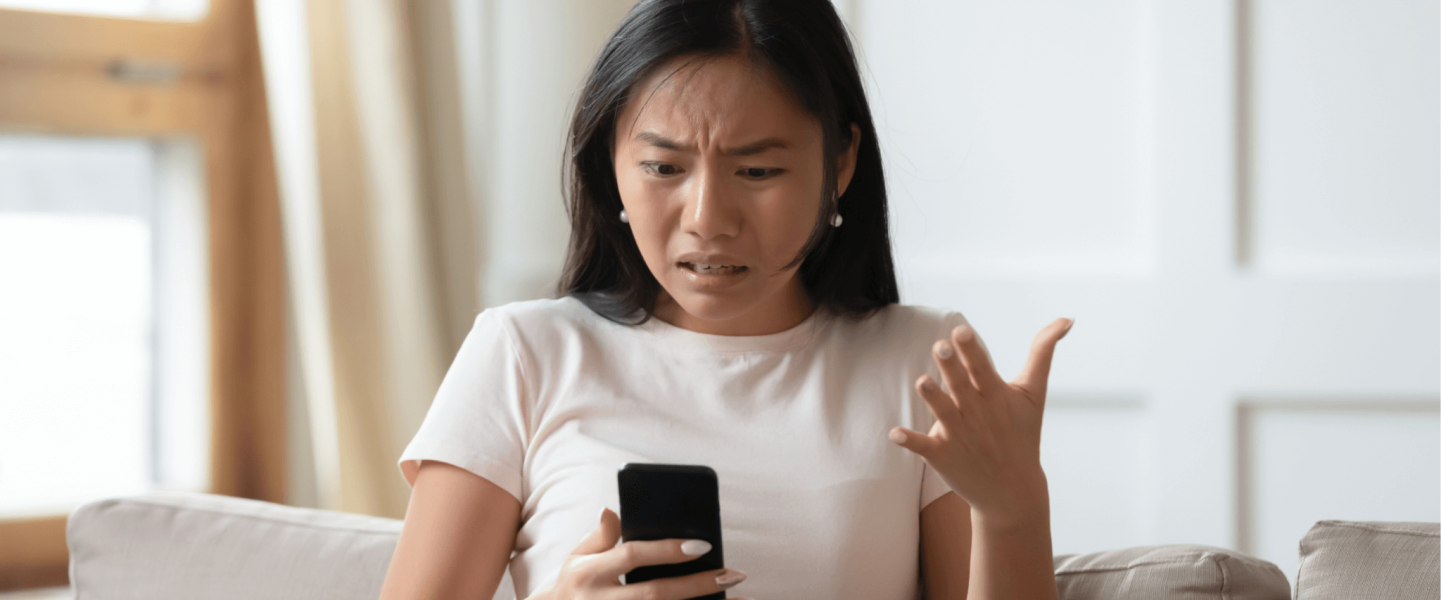 A woman researching how to improve her 593 credit score.