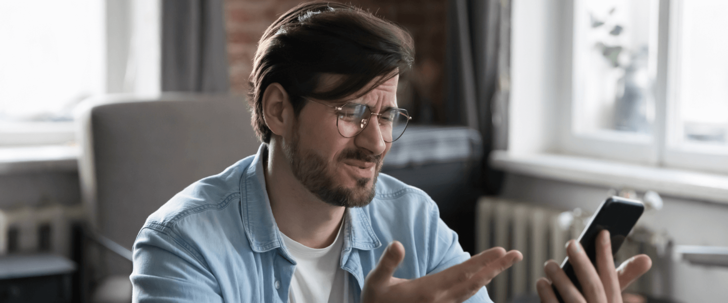 A man researching why his credit score dropped.