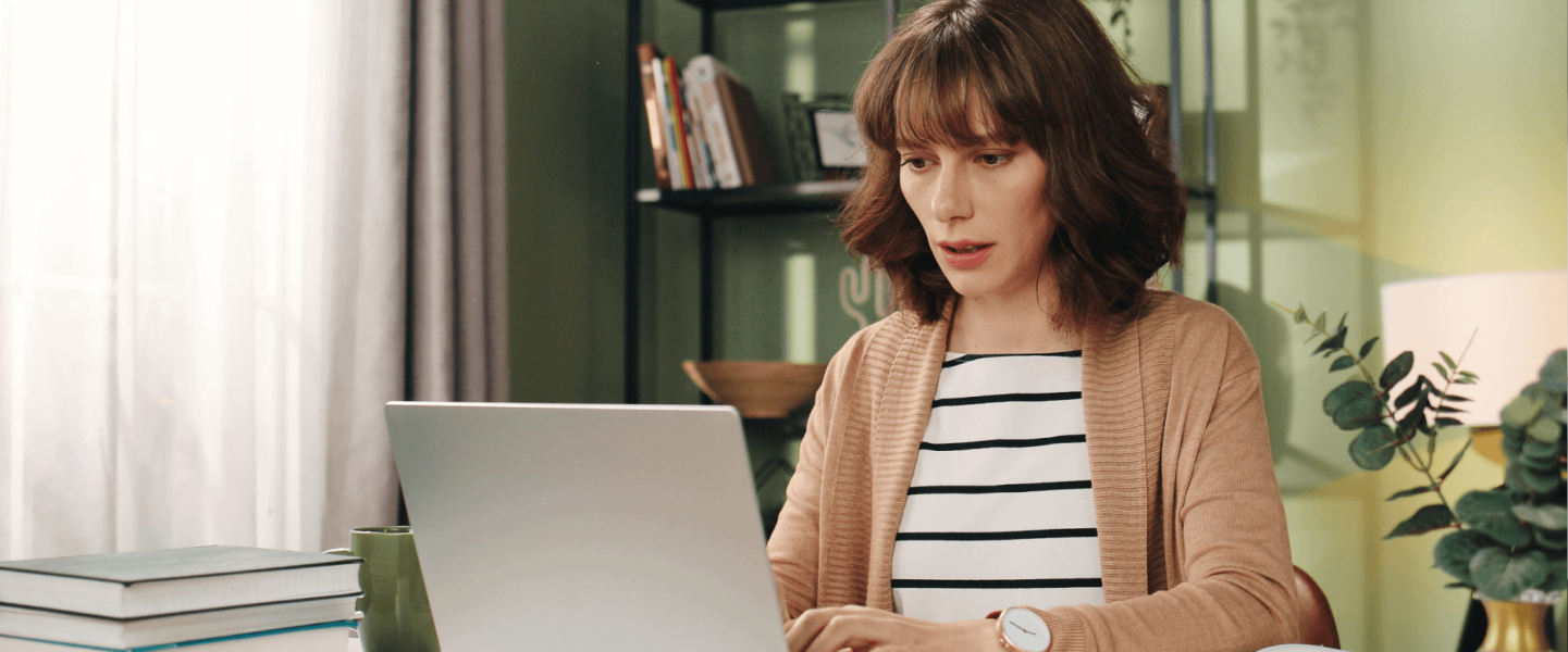 A woman looking up why her credit score dropped after collections account was removed