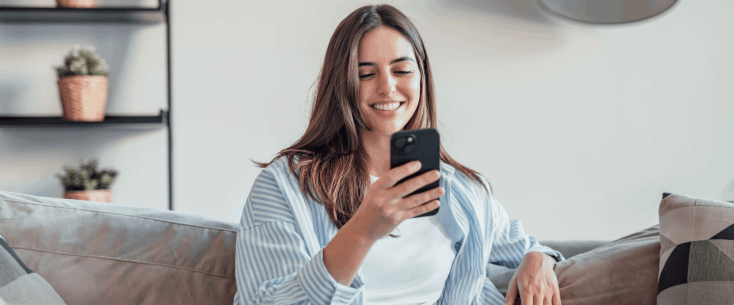 A woman researching the essential habits to maintain a high credit score.