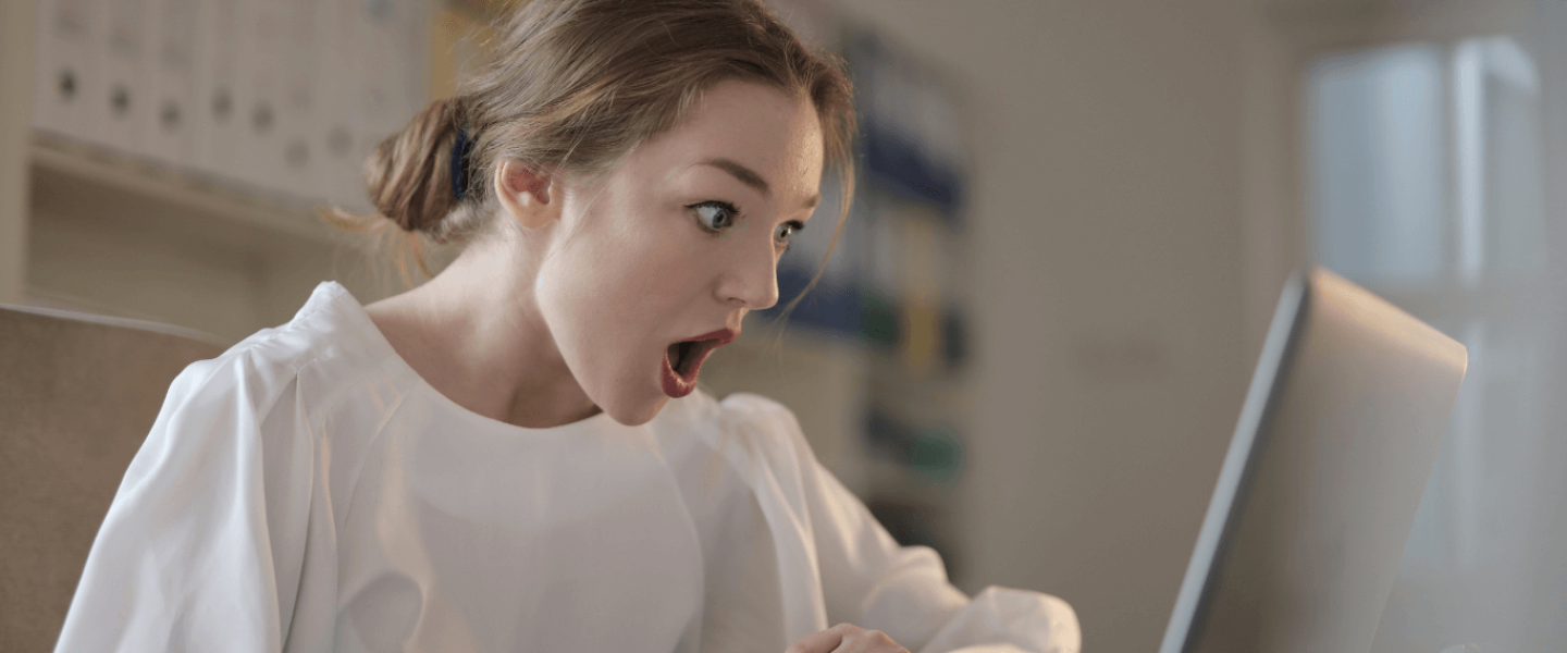 A woman realizing her credit score dropped 60 points.