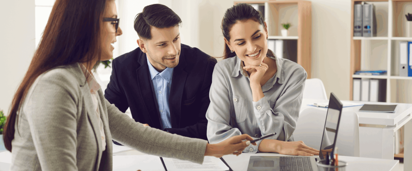 A couple chatting with an agent about if their credit scores will be affected when they modify their loans.
