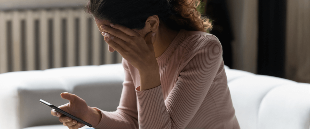 A woman researching how to rebuild her 400 credit score.