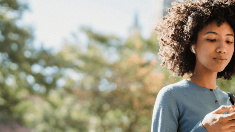 A woman researching what her 781 credit score means and how to get a an 800.