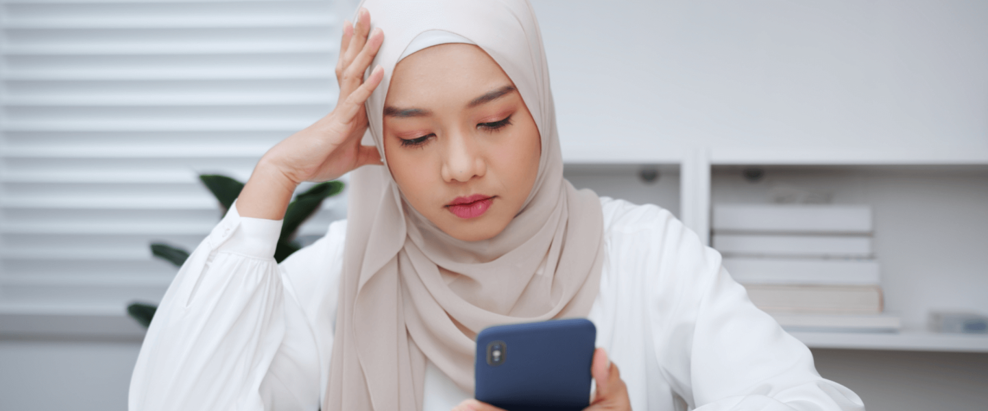 A woman looking up a 569 credit score.