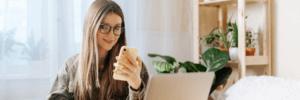 A woman on her phone looking at her credit report.