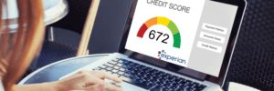 A woman checking her Experian credit score.