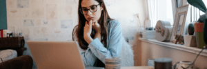 Woman using her laptop to look up Dovly AI.