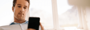 Man checking his credit score on his phone.