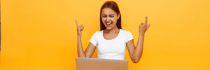 Excited woman on her laptop.