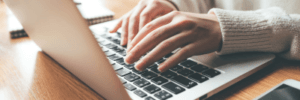 Woman researching on her laptop.