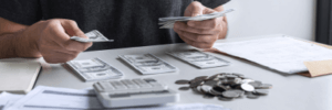 A man managing his finances and sorting his debts.