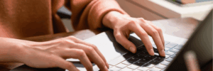 A person researching on their computer how long does it take to achieve a 770 credit score.