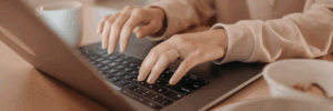 A woman researching what her 796 credit score means.